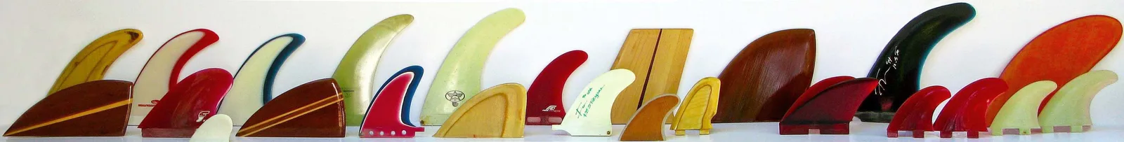 A row of vintage surfboard fins