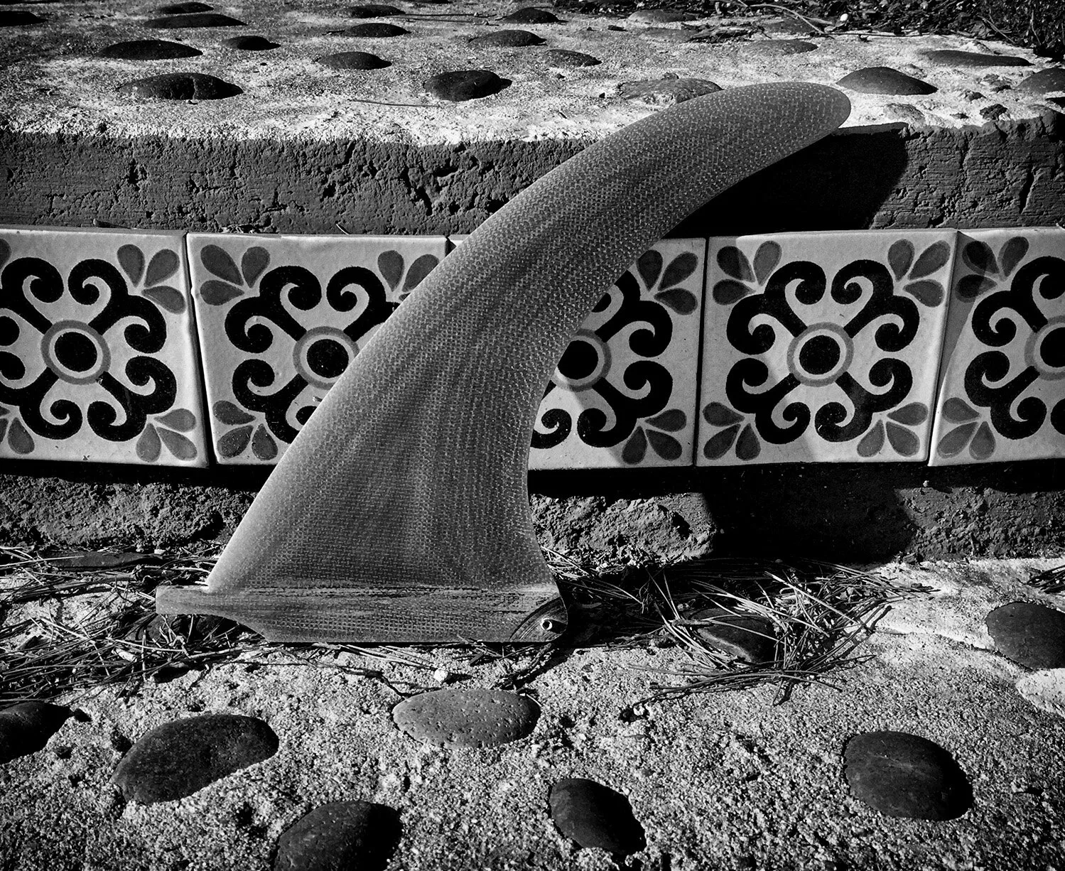 A finely foiled fiberglass single fin